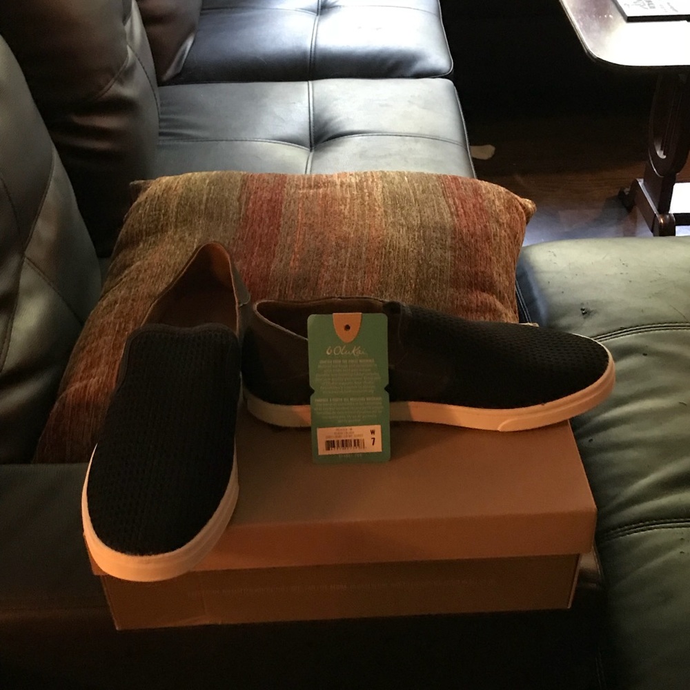 Brand new black Olukai slip ons.